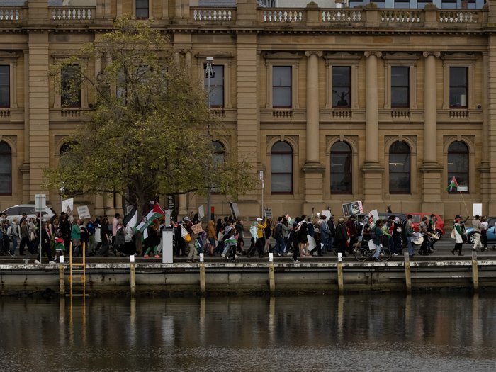 A big group of people walking in one line near the waterfront in Nipaluna/Hobart