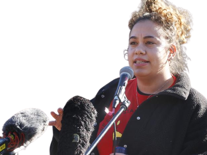 photo of Nunami, a Palawa woman, speaking into microphones.