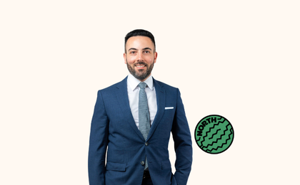 Photo of a man wearing a suit. Watermelon with the word 'North' written in it.