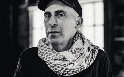 Photo of Phil Monsour wearing a kuffiyah